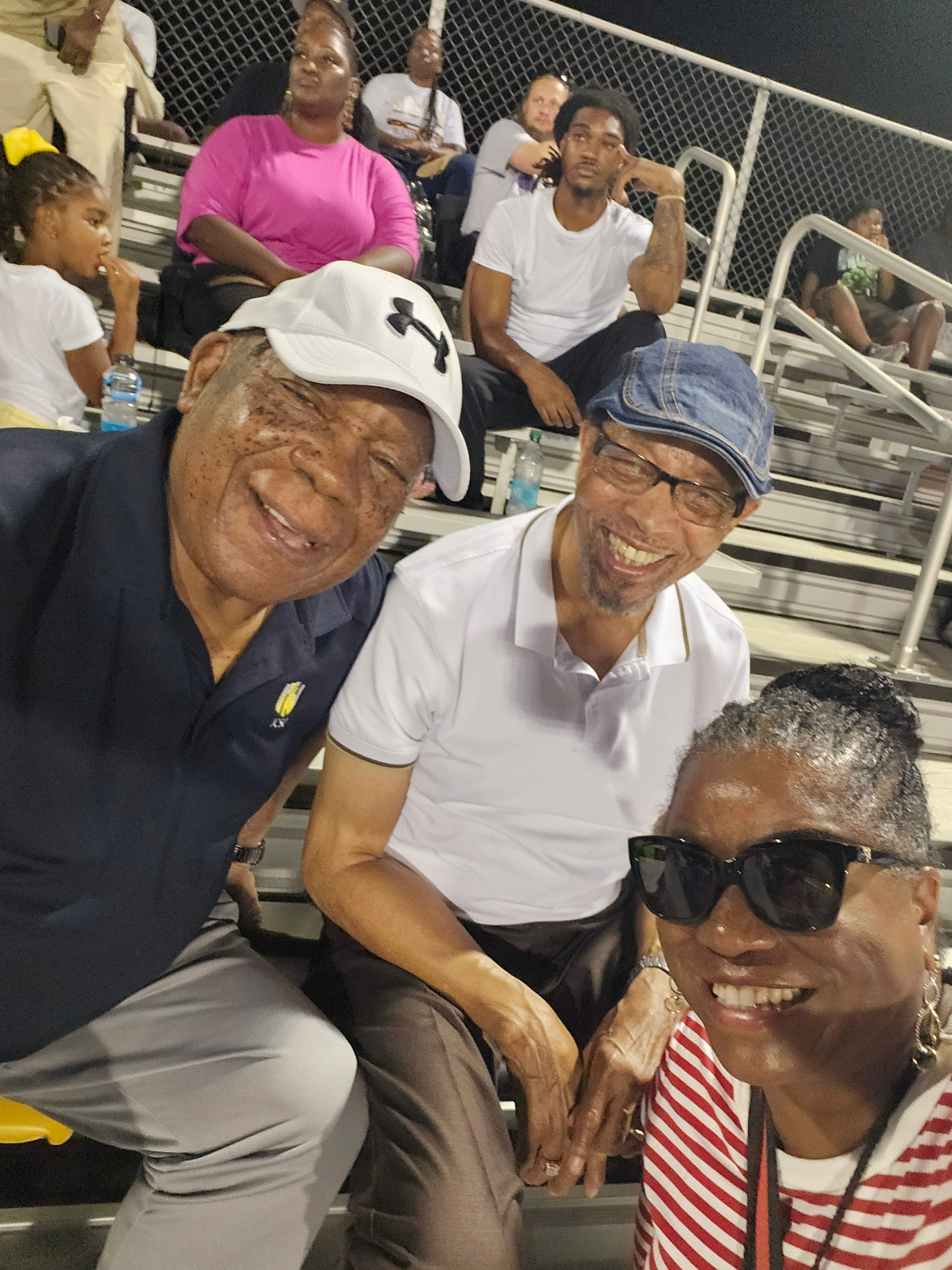 Community members and clergy at a Crestwood football event