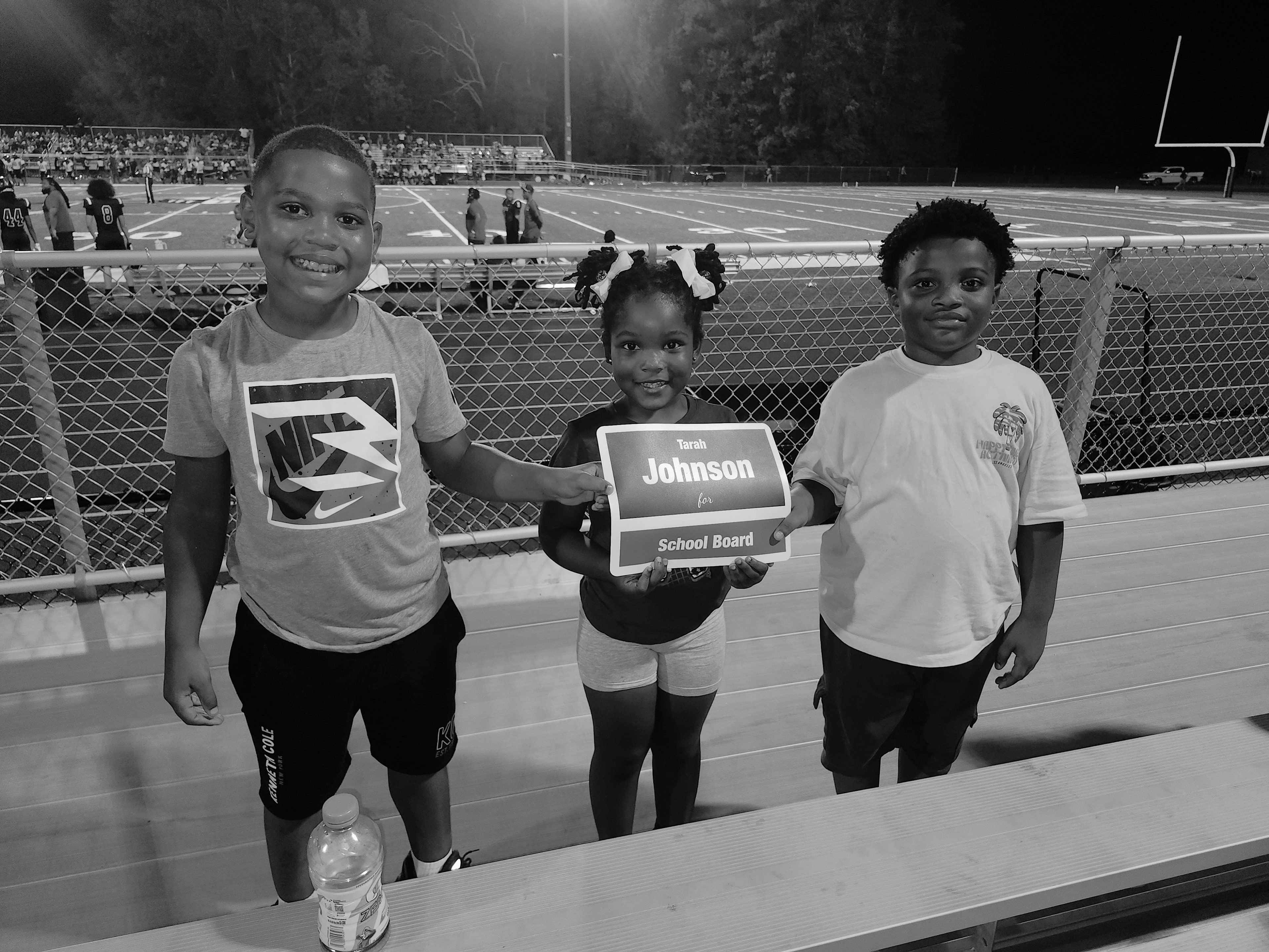 Young fans cheering at the Crestwood football game