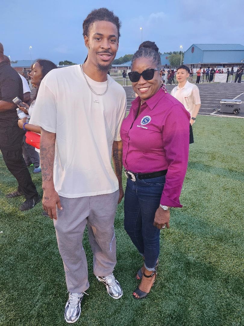 Tarah Cousar-Johnson at a community event alongside Ja Morant